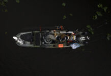 Top 7 Trends In Kayak Fishing Right Now overhead view of a Wilderness Systems fishing kayak on dark water