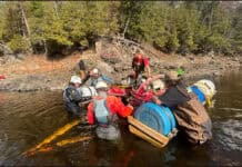 Kayakers Find Mysterious Submerged Car In Ottawa River (Video) Image of kayakers rigging a sunken stolen car to remove it from the Ottawa River.