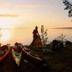Why Kayak Camping Is Better Exercise Than Backpacking Image of a kayaker setting up camp.