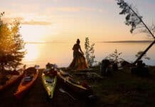 Why Kayaking Camping Is Better Exercise Than Backpacking Image of a kayaker setting up camp.