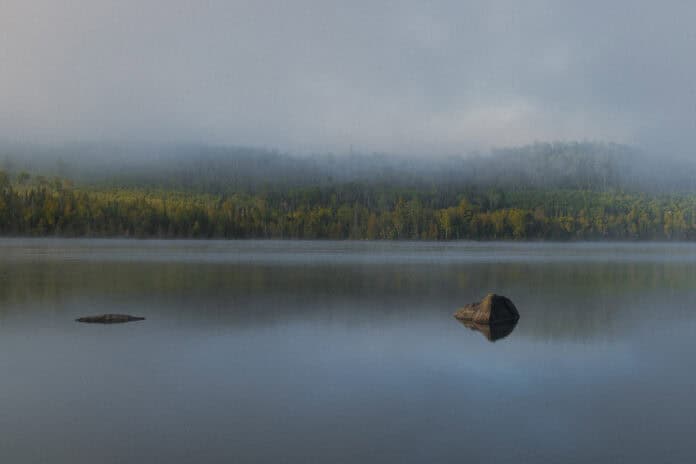Image of a foggy lake in Minnesota's Boundary Waters Canoe Area Wilderness.