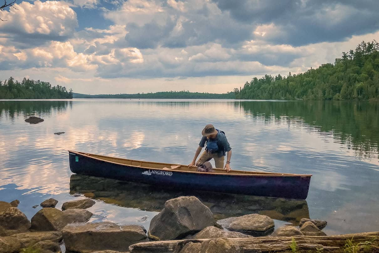 A canoeist prepares to portage in the BWCAW