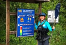 ACA’s New Smart Start Instructional Series Welcomes Newcomers ACA Education Director and Smart Start co-author Kelsey Bracewell dressed in paddling gear and standing in front of paddling safety signage
