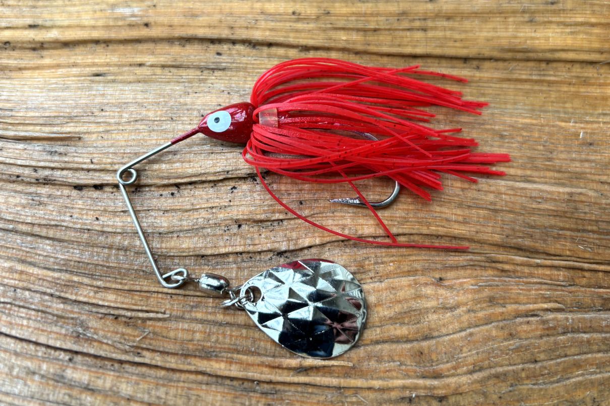 Spinnerbait with red skirt.