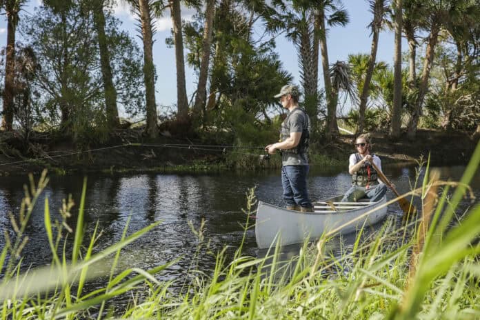 a pair canoes while fishing