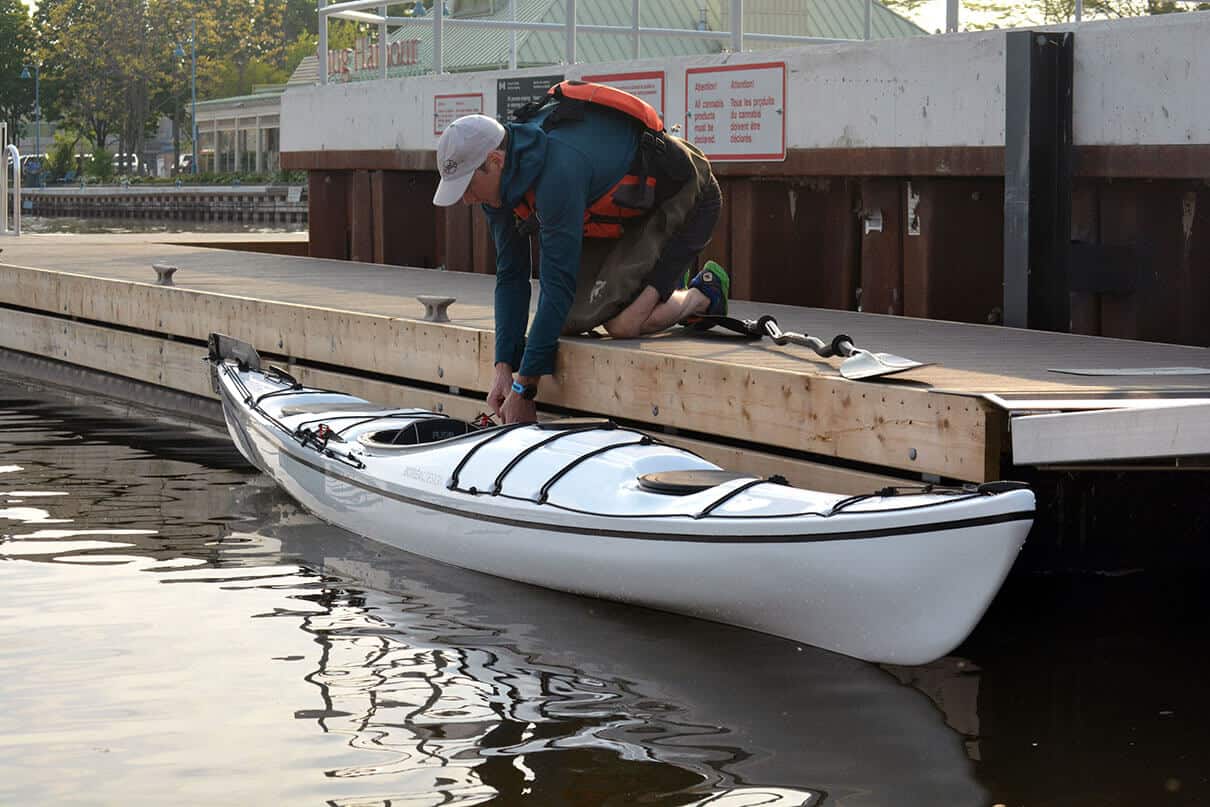 man launching the Storm 17 from a dock