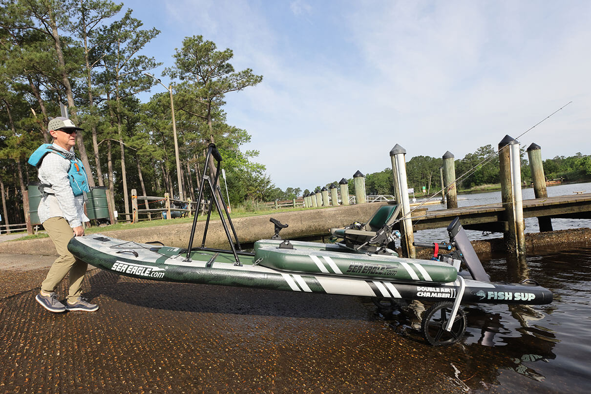 Kayak Angler editor Ric Burnley uses the integrated kayak to launch the inflated Sea Eagle FS1210