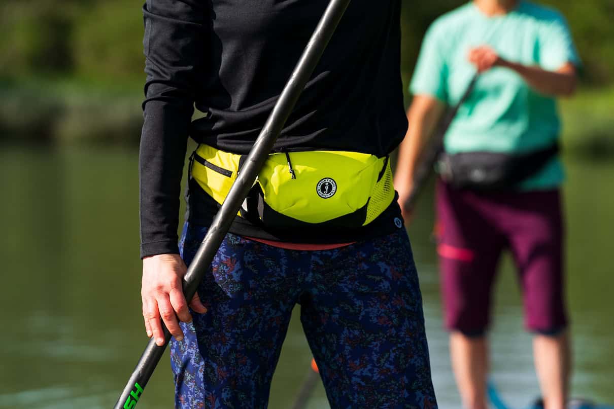 Yellow belt pack around waist.