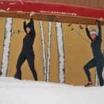 Best Base Layers For 2026 The author and Paddling Magazine editor-in-chief portaging a canoe wearing base layers.