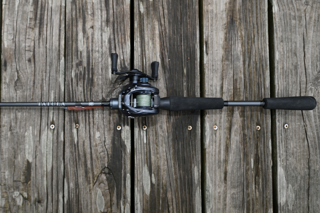 Daiwa Tatula TWS combo lying on a dock.
