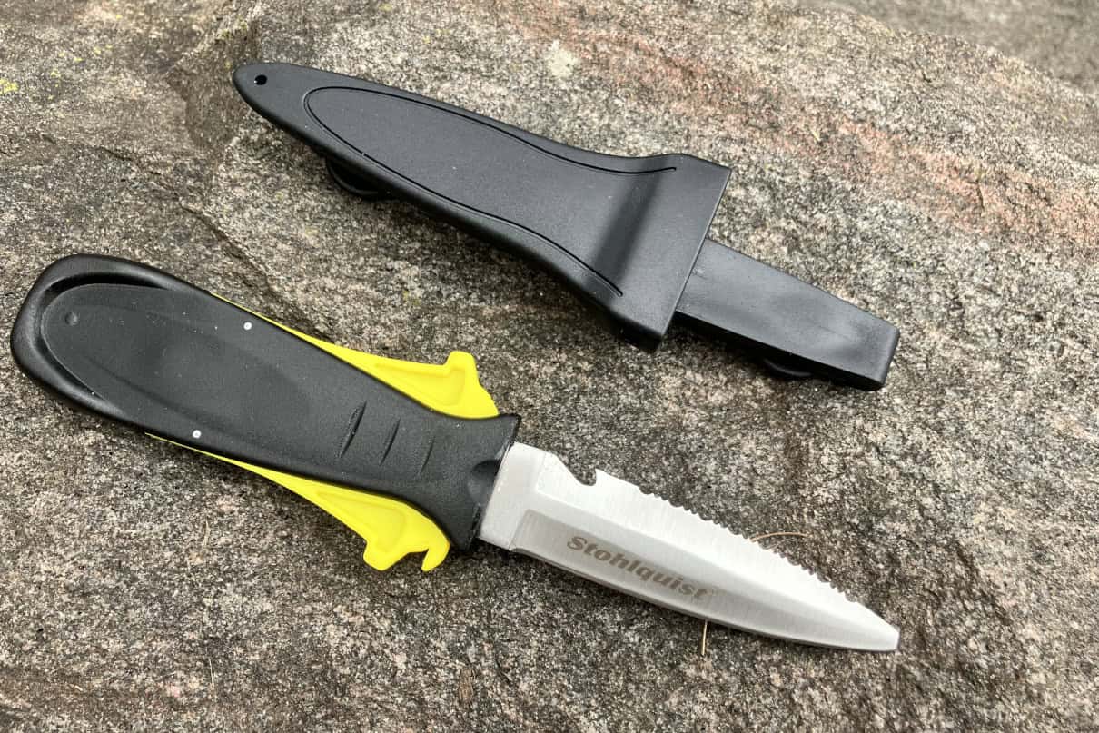 A fixed blade knife with sheath.