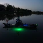 Light It Up: DIY Kayak Lighting In One Day Cory Byrnes in his kayak at dusk with DIY lighting installed
