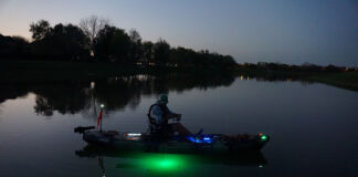 Light It Up: DIY Kayak Lighting In One Day Cory Byrnes in his kayak at dusk with DIY lighting installed
