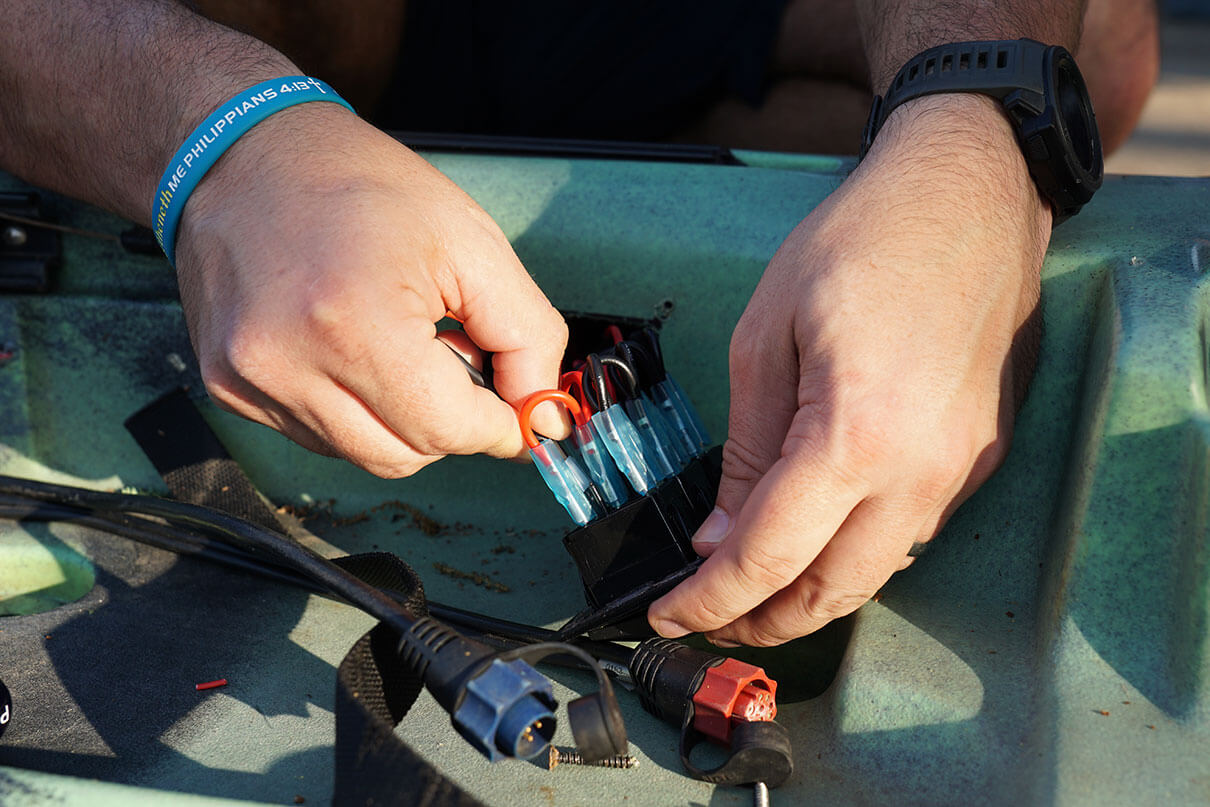 Cory Byrnes connects his kayak lighting