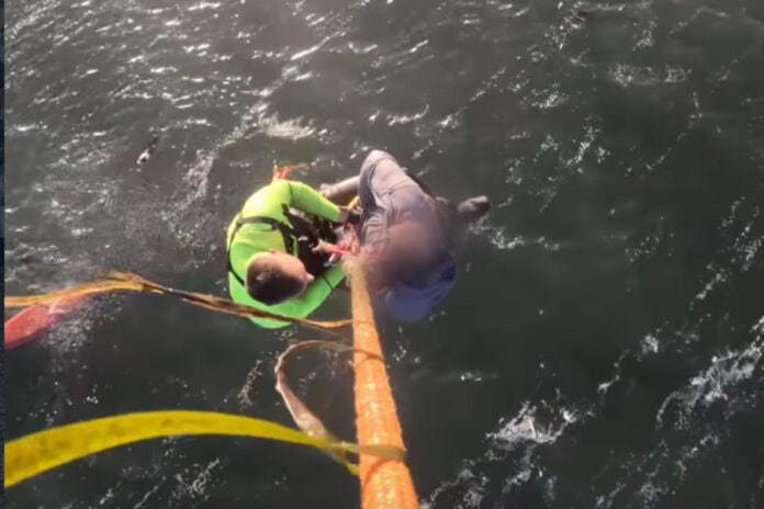 Image of the kayaker and dog rescued in Tomales Bay, California