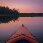 The Best Tested And True Paddling Gear, Because If It Isn’t Broken Why Fix It A wilderness systems pungo kayak on a calm lake