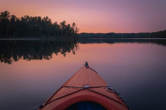 A wilderness systems pungo kayak on a calm lake