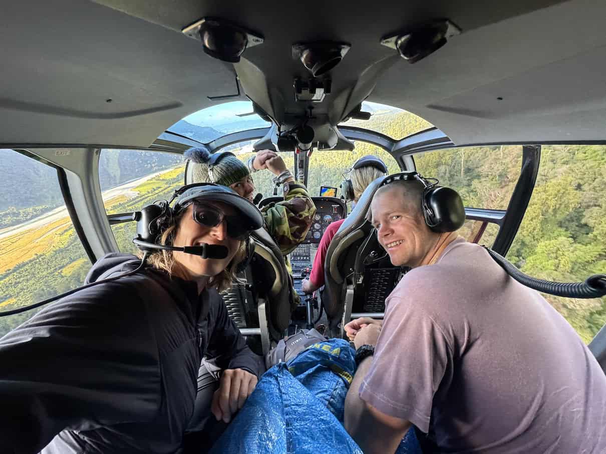 Four people sitting in helicopter