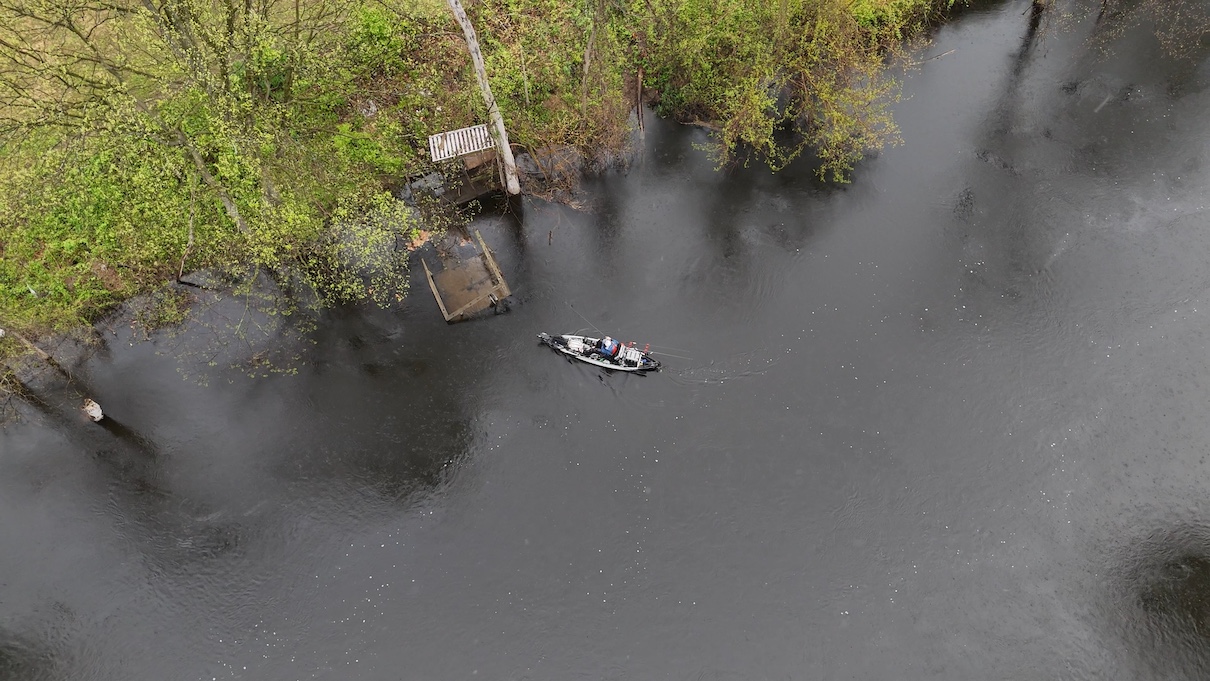 Overhead shot of fishing kayak nex to dock
