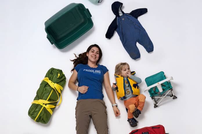 Marissa Trepanier poses with her son Sebastian and gear for canoe camping with a toddler