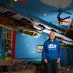 Inside America’s Largest Private Collection Of Kayaks: Charles Albright’s Boat House Charles Albright stands in the living room of his Boat House, housing his extensive collection of kayaks