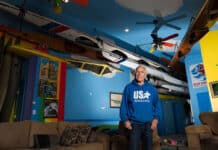 Inside America’s Largest Private Collection Of Kayaks: Charles Albright’s Boat House Charles Albright stands in the living room of his Boat House, housing his extensive collection of kayaks