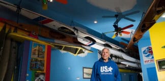Inside America’s Largest Private Collection Of Kayaks: Charles Albright’s Boat House Charles Albright stands in the living room of his Boat House, housing his extensive collection of kayaks