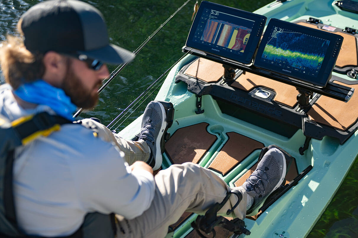man fishes from a kayak equipped with Garmin Echomap Ultra 2 fish finder