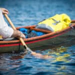 In Defense Of The Goon Stroke man paddles a tripping canoe using the goon stroke