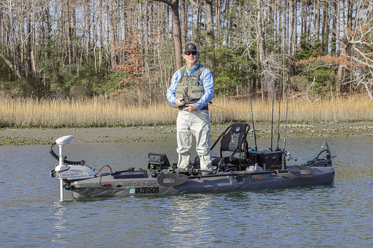 Kayak Angler editor Ric Burnley stands and fishes for largemouth bass from a kayak