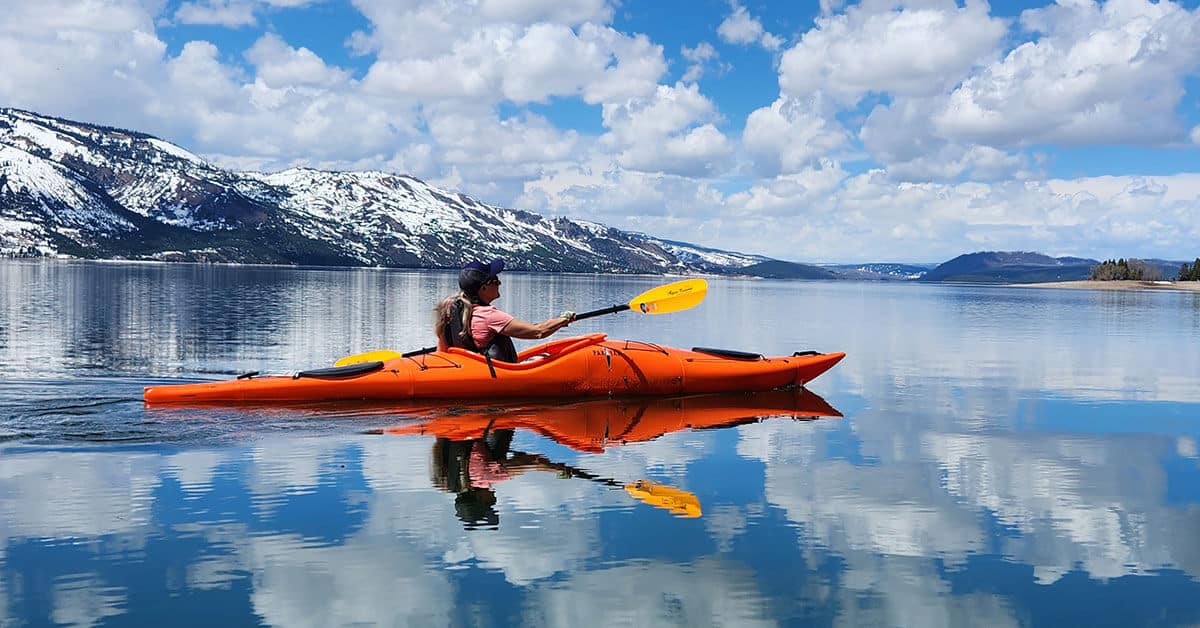 woman paddling the Pakayak Bluefin modular touring kayak