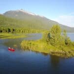 Celebrate Go Paddle Day a tandem canoe on a lake