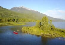 Celebrate Go Paddle Day a tandem canoe on a lake