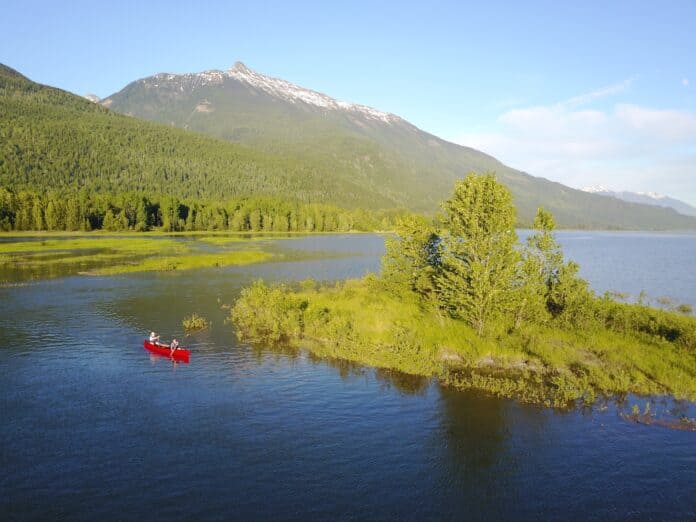 a tandem canoe on a lake