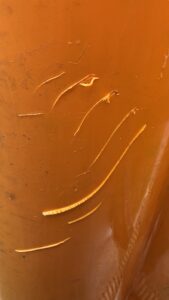 Scrapes on orange kayak