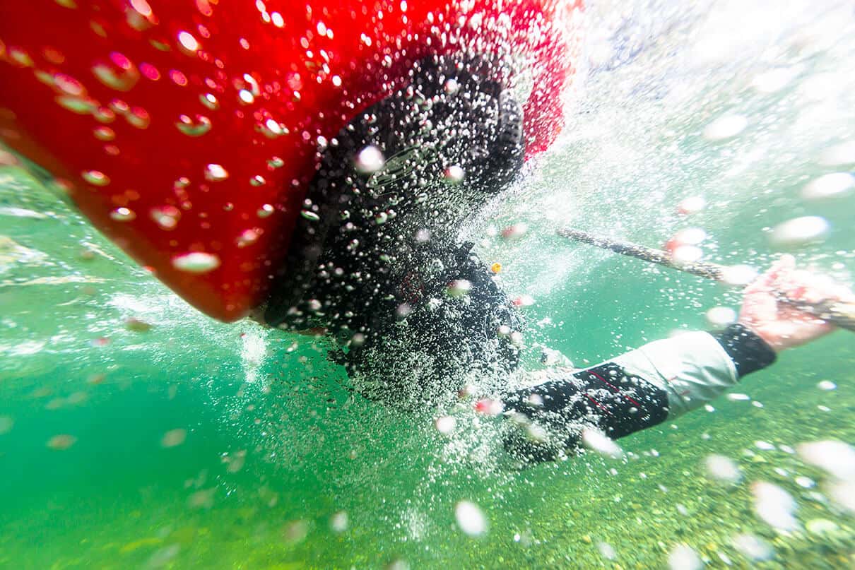 underwater photo of a sea kayaker mid-roll