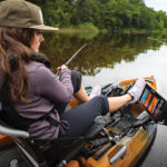 Gear Of The Year 2026: Inshore woman fishes from a kayak equipped for inshore fishing with a Humminbird XPLORE fish finder