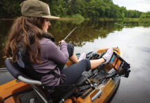 Gear Of The Year 2026: Inshore woman fishes from a kayak equipped for inshore fishing with a Humminbird XPLORE fish finder