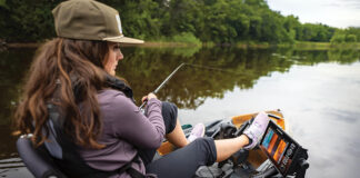 Gear Of The Year 2026: Inshore woman fishes from a kayak equipped for inshore fishing with a Humminbird XPLORE fish finder