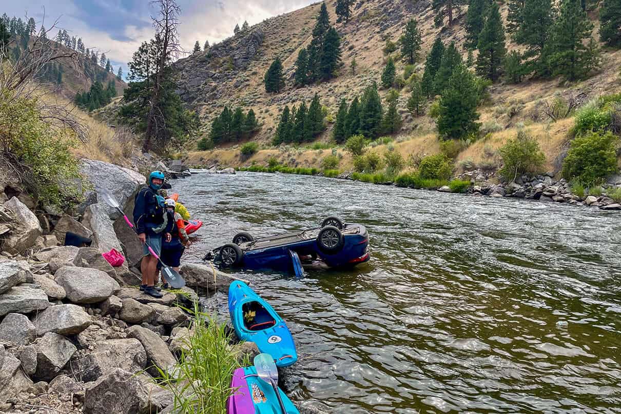 Boaters jumped into action to rescue two occupants when this vehicle flew off-road into the North Fork Payette River
