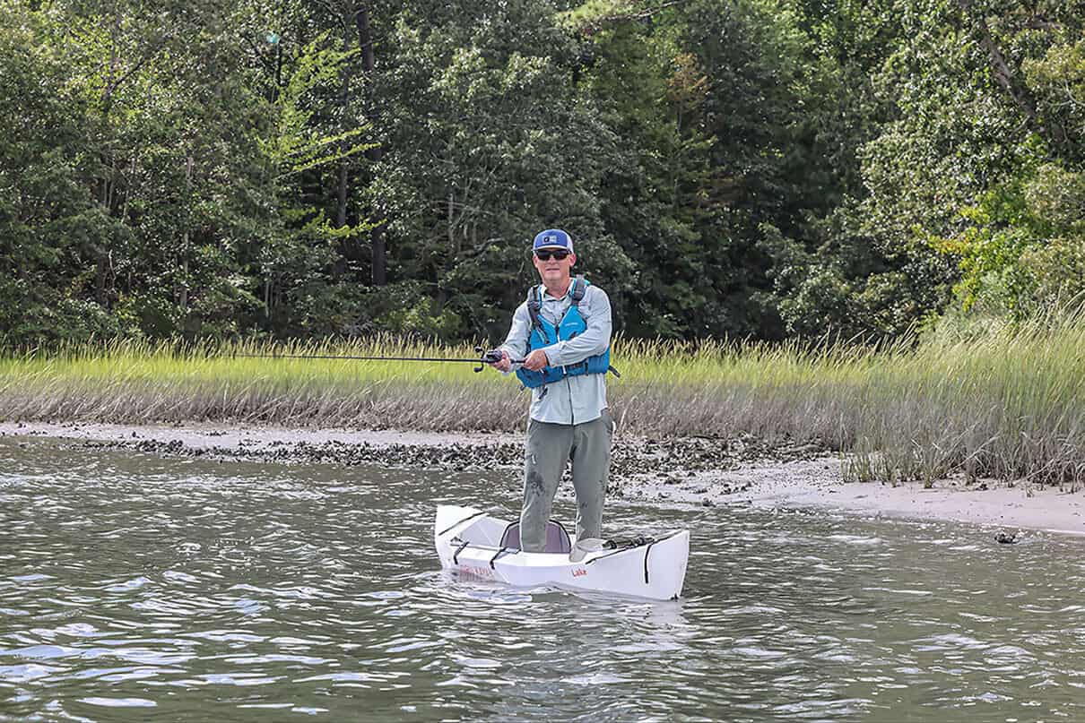 Kayak Angler editor Ric Burnley stands and fishes from the Oru Lake Sport