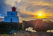 Fish Vancouver Island: Catch Halibut, Lingcod And Salmon sun shines on a scenic lighthouse on Vancouver Island's rocky coast