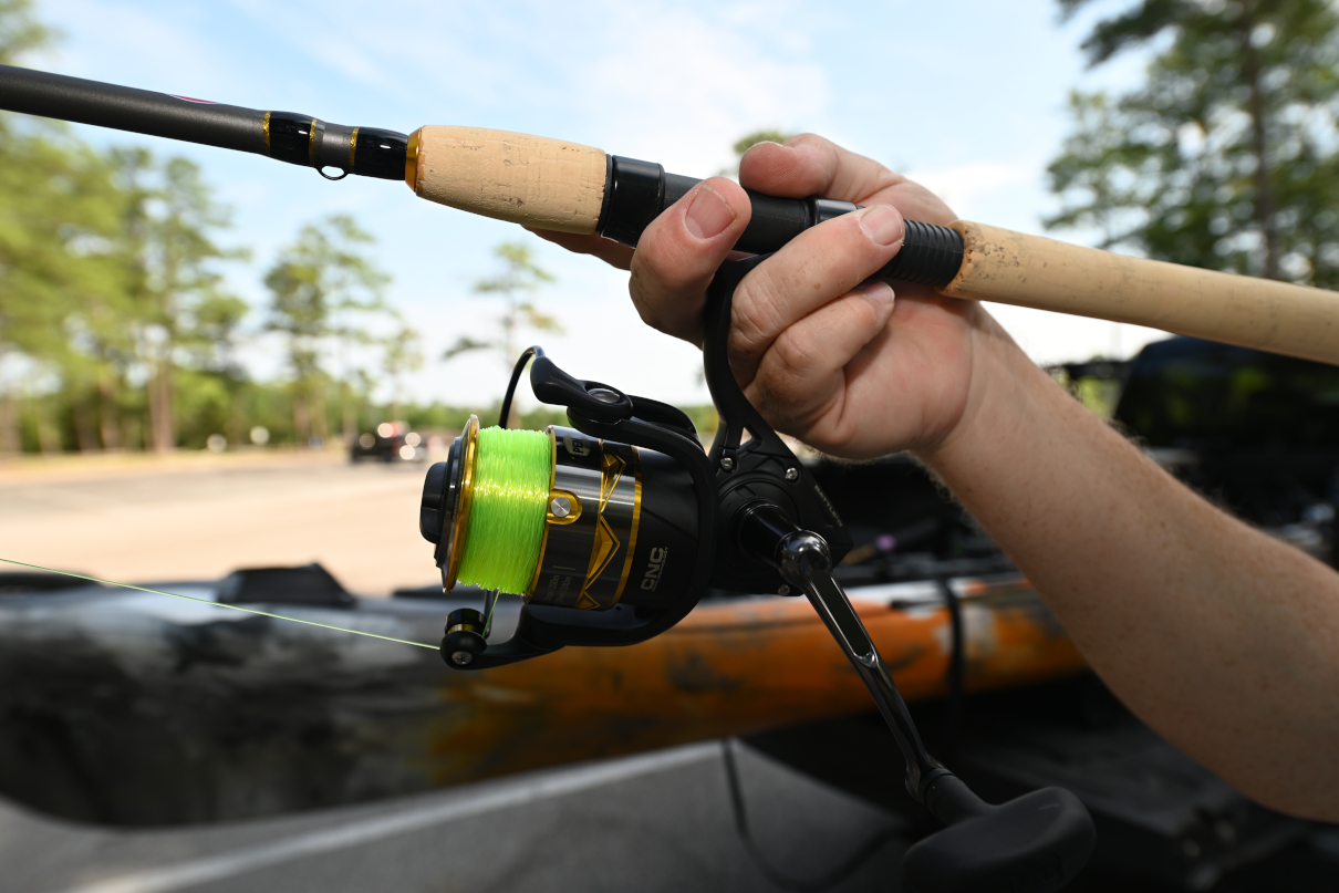 Penn Battle IV rod held by angler.