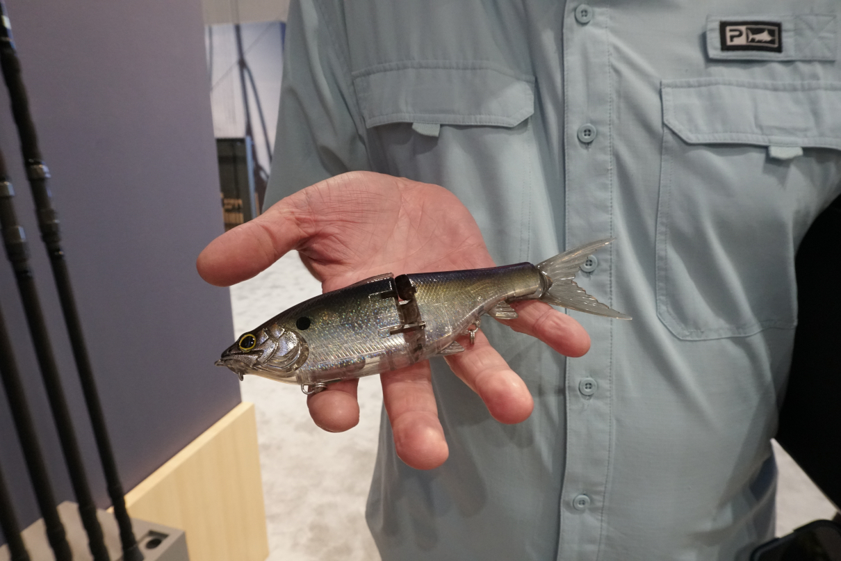 Shimano glidebait being held by angler at ICAST show.