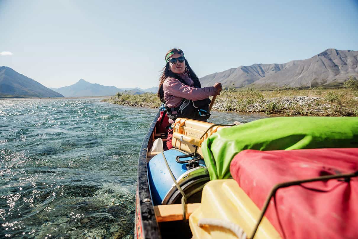 Bobbi Rose Koe paddles a packed canoe in Canada's North