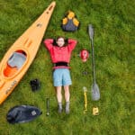 What’s In Editor Joe Potoczak’s Class Fun River Running Kit Paddling Magazine Editor Joe Potoczak lays on grass surrounded by his river running gear selections