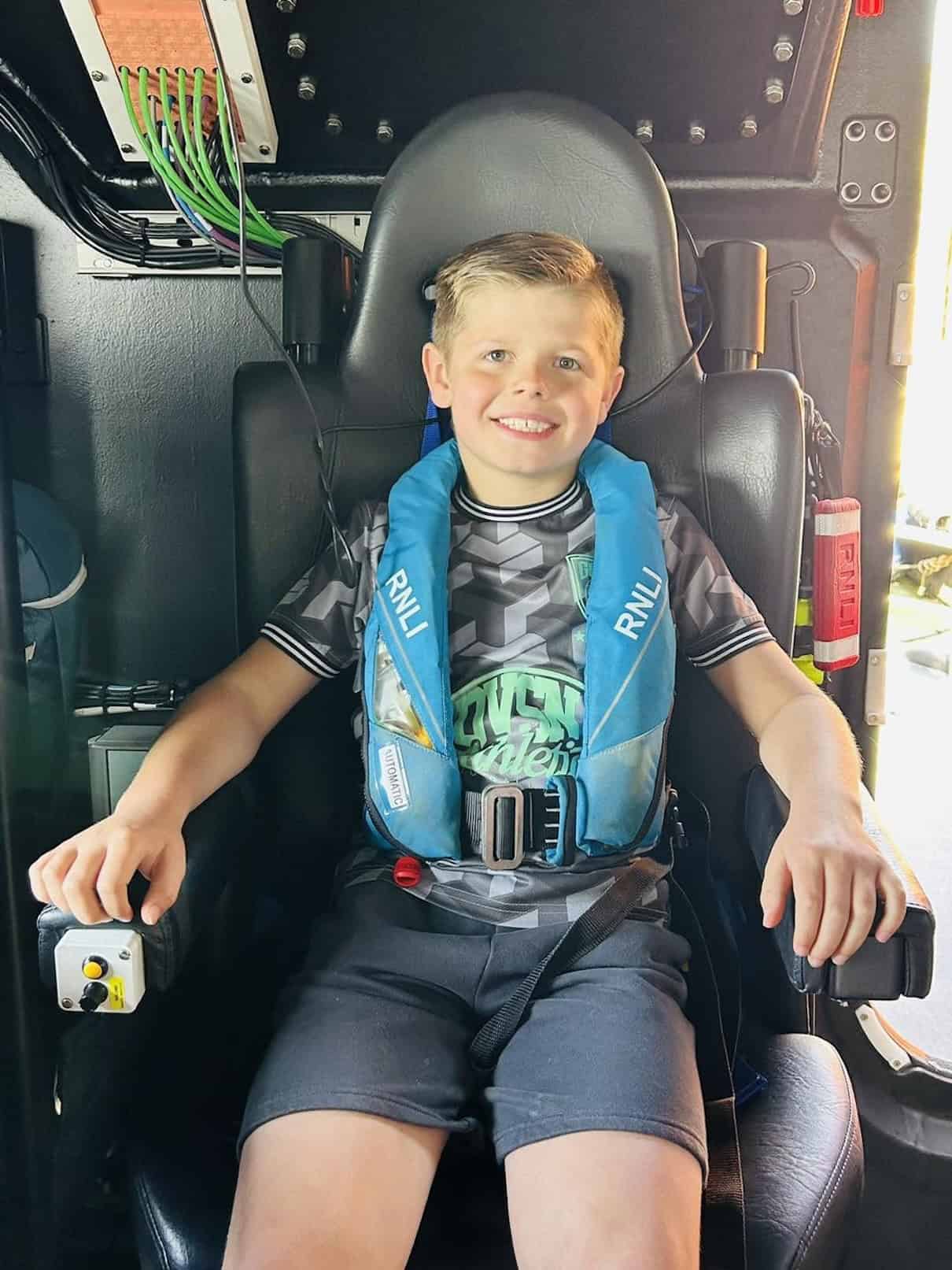 boy in a rescue boat