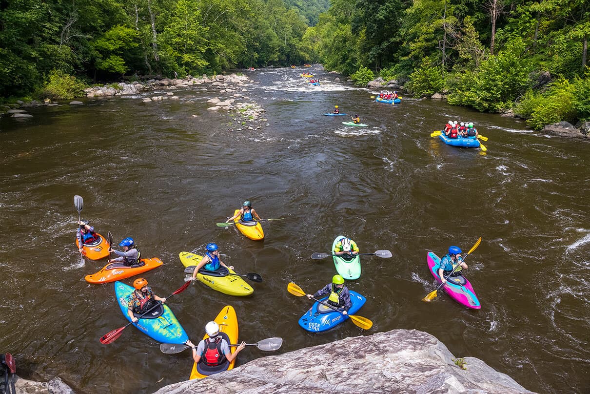 A women's paddling group gathers below Entrance rapid