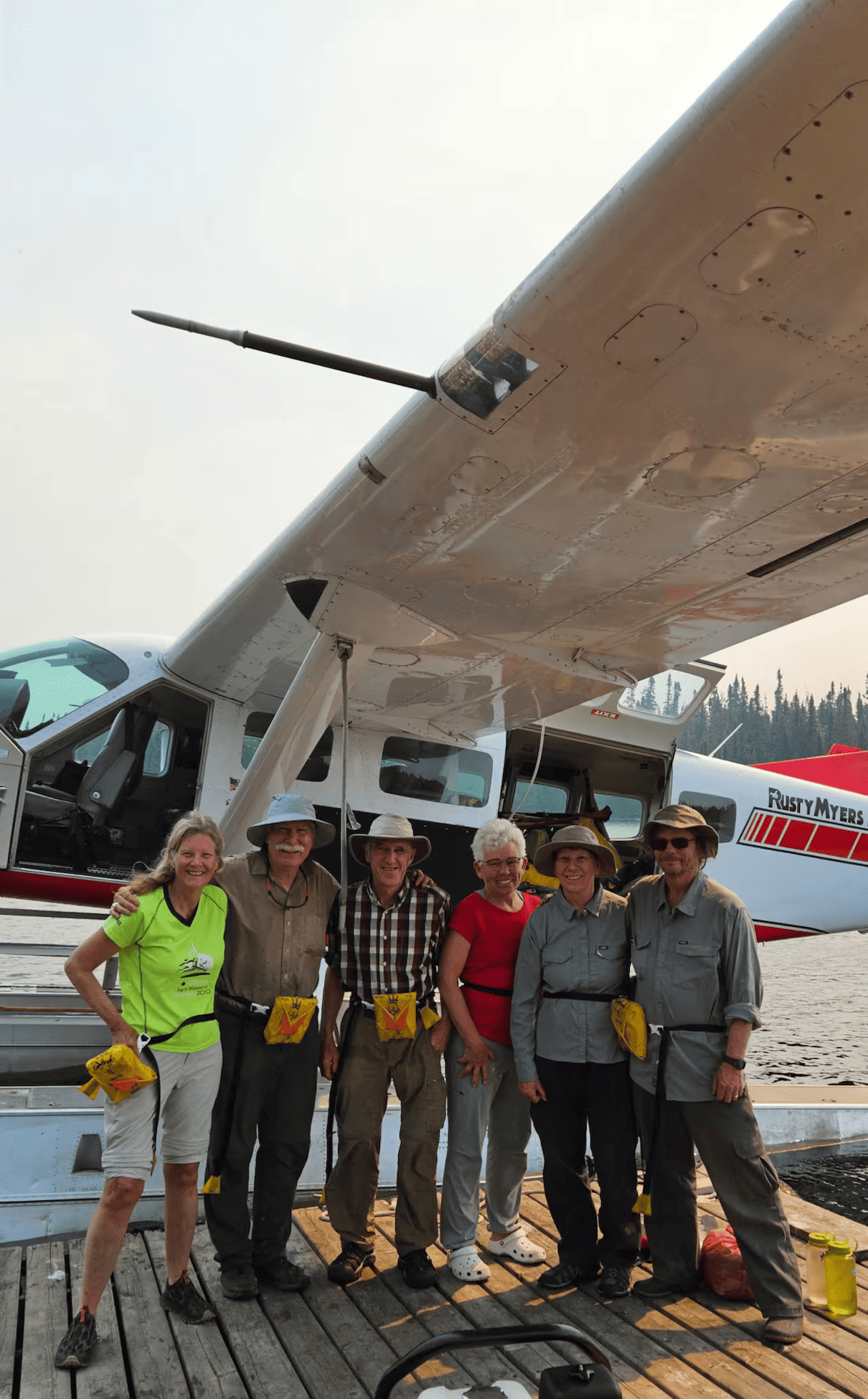 people standing in front of floatplane