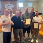 Anglers Save Drowning Man After Motorboat Flips Kayak Men receiving an award